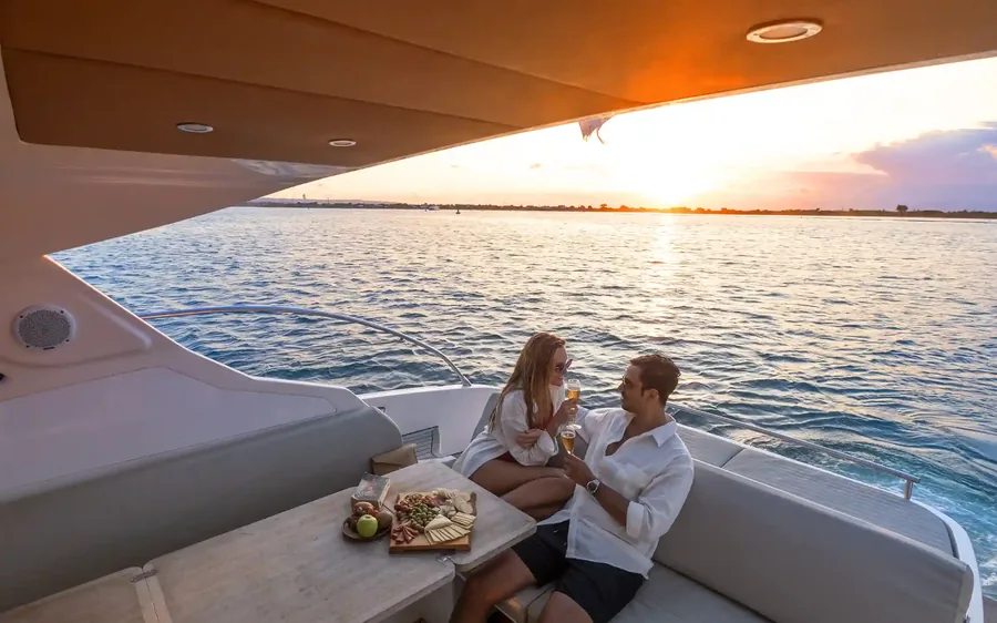 Couple on the deck of a private yacht at sunset in Bali
