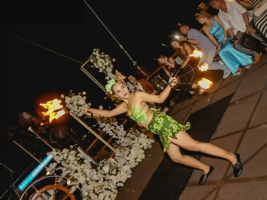 Balinese fire dancer performing at an evening celebration in Bali